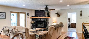 Dog-friendly mountain home with covered deck, scenic views, firepit, & game room