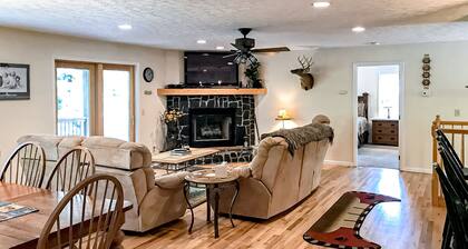 Dog-friendly mountain home with covered deck, scenic views, firepit, & game room