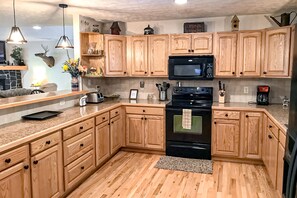 Fridge, microwave, oven, stovetop - Dog-friendly mountain home with covered deck, scenic views, firepit, & game room (Sugar Mountain)