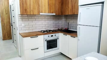 Fridge, oven, electric kettle, cookware/dishes/utensils