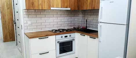 Fridge, oven, electric kettle, cookware/dishes/utensils