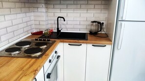 Fridge, oven, electric kettle, cookware/dishes/utensils