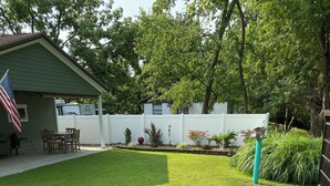 A well-maintained backyard with a lawn, patio, and outdoor seating area. - Quaint, private setting, 3-4 miles from SOMC & KDMC hosp. (Portsmouth)