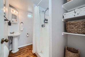 Shower, hair dryer, towels, shampoo