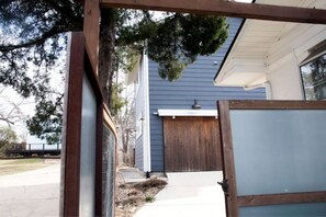 Stroll up to the charming home with a welcoming entrance and a tree-lined approach.