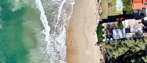 On the beach, sun-loungers