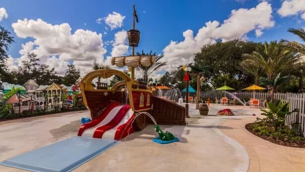 A water play area with a pirate ship, a slide, and a fountain. - Universal Studios.Townhome.3BR.Private Pool! (Davenport)