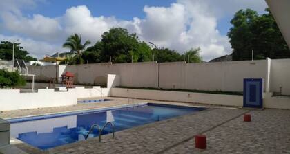 The apartment has a balcony overlooking the city.