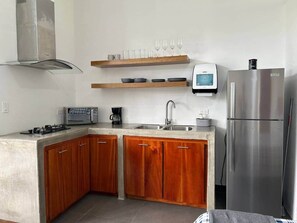 Fridge, microwave, stovetop, coffee/tea maker
