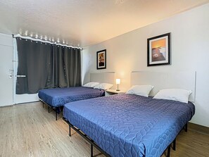 Room, 2 Double Beds | Free WiFi, bed sheets