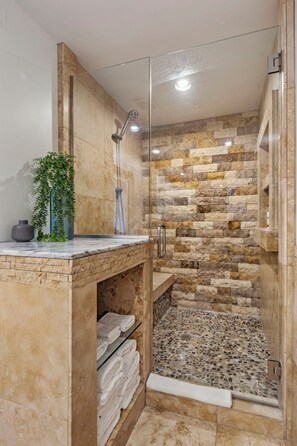 Shower, eco-friendly toiletries, hair dryer, towels