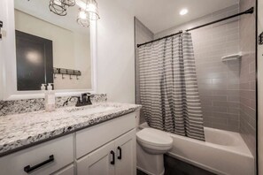 Combined shower/bathtub, shampoo