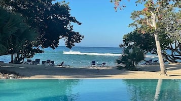On the beach, sun loungers, beach towels