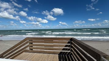 On the beach, sun loungers, beach towels