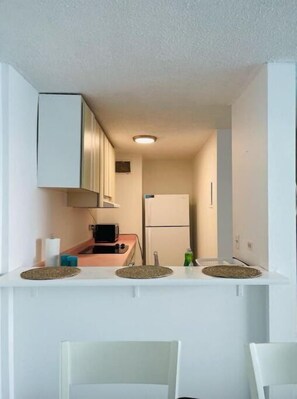 Fridge, microwave, stovetop, coffee/tea maker
