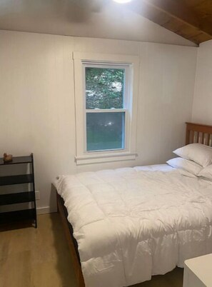 Enjoy a peaceful retreat with a single bed and serene views of the surrounding greenery.