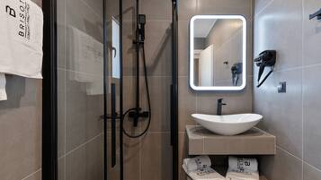 Shower, rainfall showerhead, hair dryer, towels