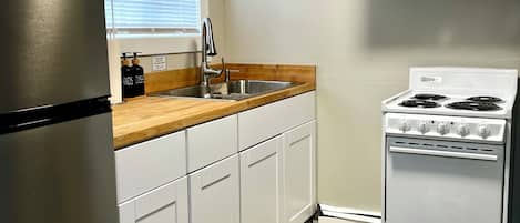 Fridge, microwave, stovetop, coffee/tea maker