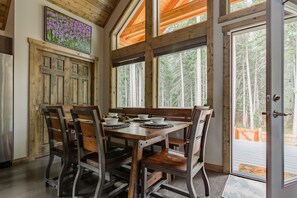 Dining - Sleeps 11 across 3 bedrooms, every bed a real one. Hot tub, full kitchen, game room with 100 DVDs and Skee Ball, fast wifi, and a big fenced yard backed by pines. Five minutes to Roslyn and Lake Cle Elum. Forty-five minutes to Snoqualmie Pass. (Ronald)