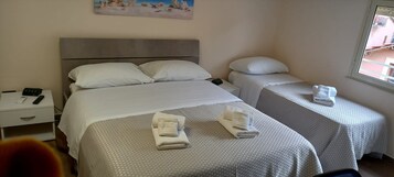 Standard Triple Room | Minibar, desk, laptop workspace, soundproofing