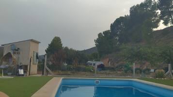 Outdoor pool, pool umbrellas, pool loungers