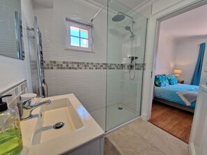 Bathtub, eco-friendly toiletries, hair dryer, towels