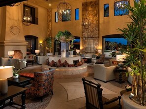 Relax in our inviting lobby, featuring a cozy fireplace, comfortable seating, and beautiful artwork.