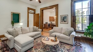 A living room with two sofas, a coffee table, and a ceiling fan. - The Selbert - In the Heart of The Bourbon Trail! (Frankfort)