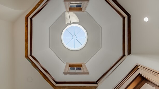 A room with a central octagonal skylight and a circular window. - The Selbert - In the Heart of The Bourbon Trail! (Frankfort)