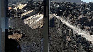 A window view of a volcanic landscape with a mountain in the background. - EcoFunco (Santa Catarina do Fogo)