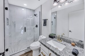 Shower, hair dryer, towels, soap