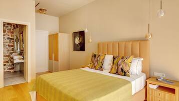 A bedroom with a bed, bedside table, and a wardrobe.