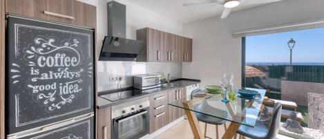 Coffee/tea maker, fridge, microwave, oven