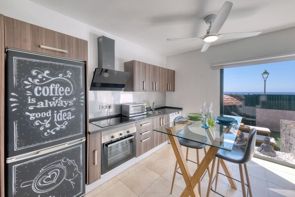 Coffee/tea maker, fridge, microwave, oven