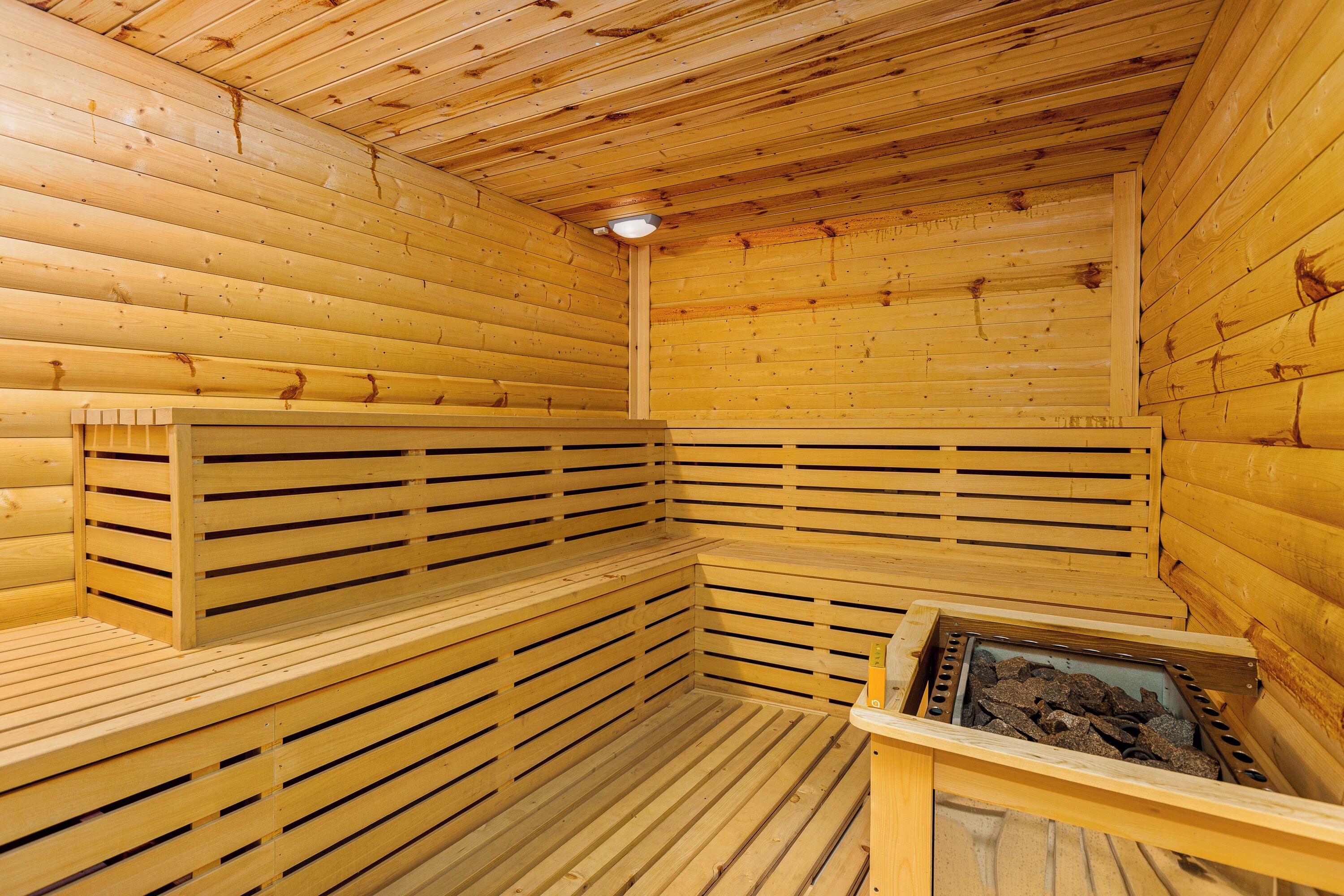 A sauna with wooden walls and benches.