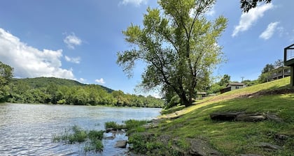 Gound level and private home with 142 feet of river front access.