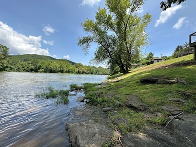 Gound level and private home with 142 feet of river front access. 