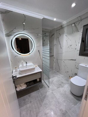 Shower, hair dryer, towels, soap