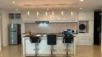 Fridge, microwave, stovetop, coffee/tea maker