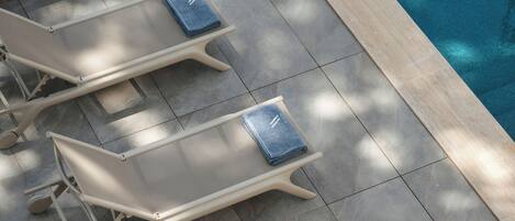 Seasonal outdoor pool, pool umbrellas, pool loungers