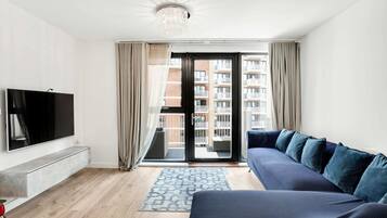 Basic Apartment, 2 Double Beds | Living area | TV