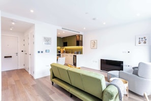 Basic Apartment, 1 King Bed | Living area | TV