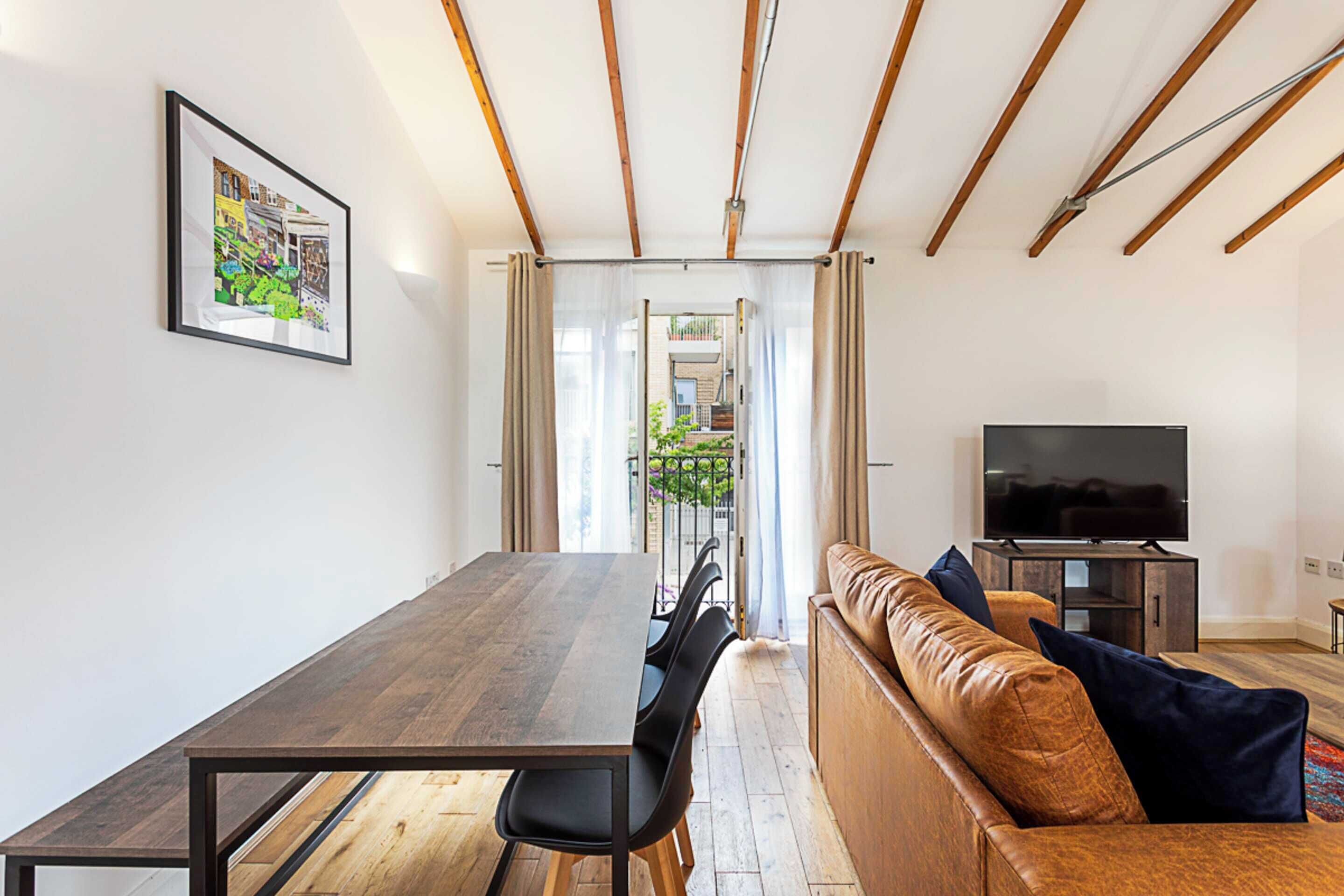 Basic House, 2 Double Beds | Living area | TV