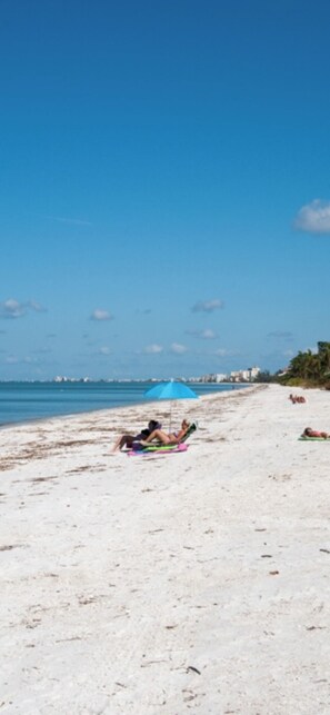 On the beach, sun loungers, beach towels