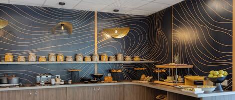 A modern kitchen with wooden cabinets, a curved countertop, and a decorative backsplash with wavy lines.