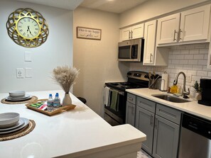 Fridge, microwave, coffee/tea maker, toaster