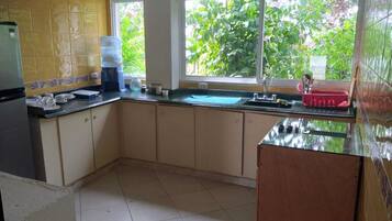 Comfort Double Room | Private kitchen | Full-sized fridge, cookware/dishes/utensils, freezer