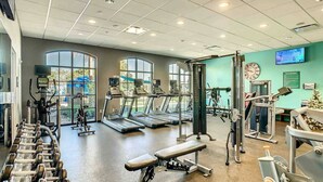 A gym with treadmills, dumbbells, and weight machines. - Amazing Themed Villa with Private Pool (Kissimmee)