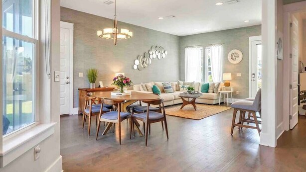 A spacious living room with a dining area, a sofa set, and a chandelier. - Sweet-P*Heated Private Pool (Miramar Beach)