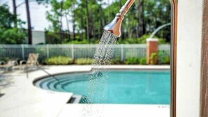 A pool with a showerhead spraying water into it. - Sweet-P*Heated Private Pool (Miramar Beach)